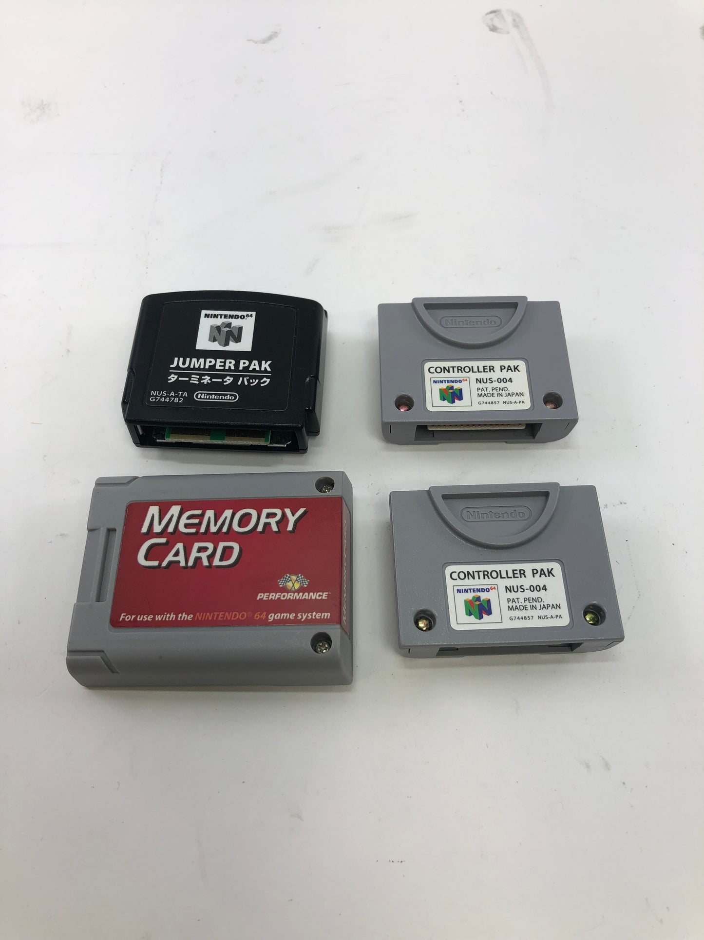 Nintendo 64 N64 Lot of 4 Accessories - Controller Paks, Jumper Pak, Memory Card