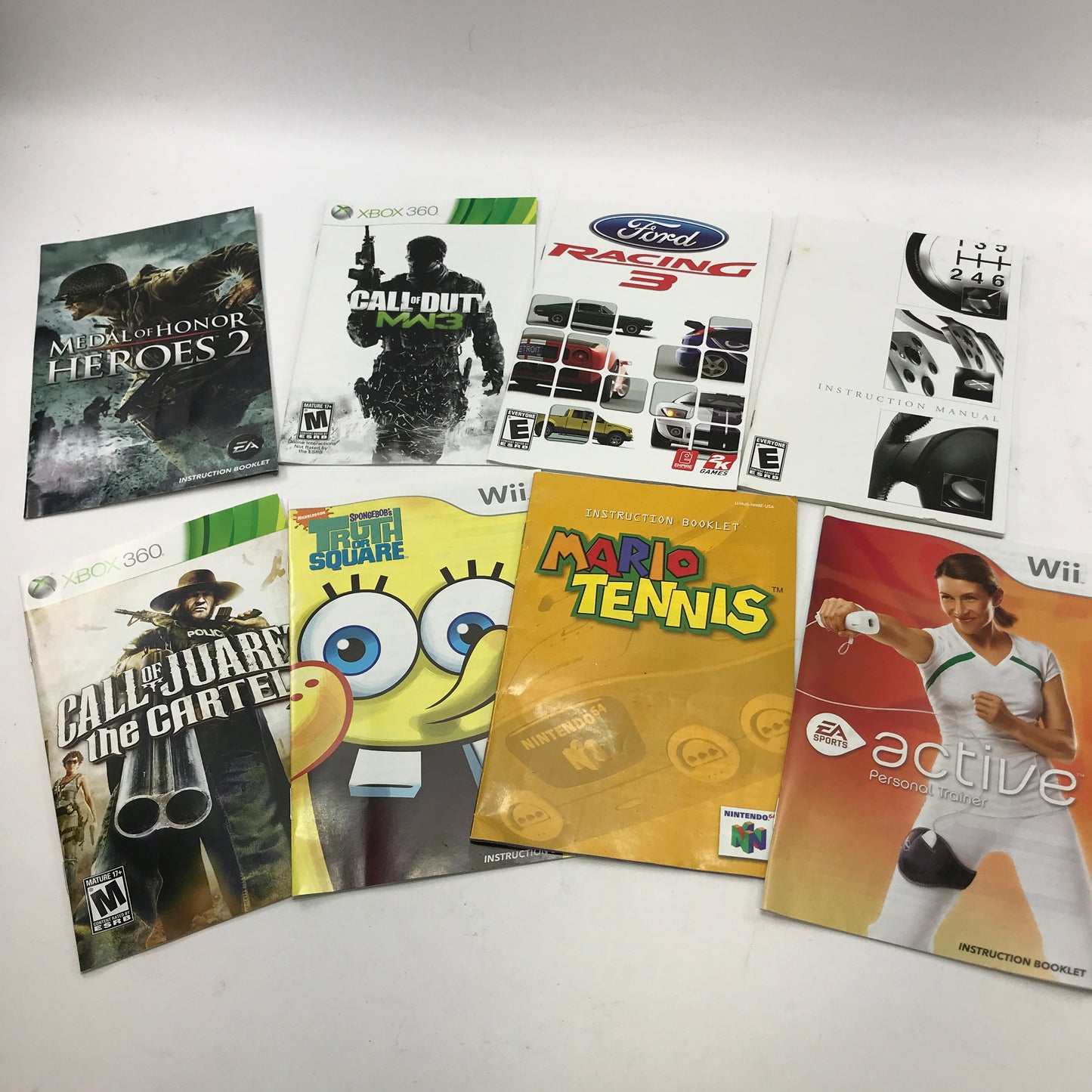Lot of 93 Assorted Game Manuals [Wii, N64, NES, PS2 and More]  READ